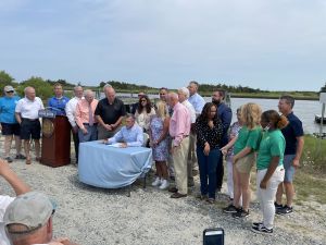 Gov. John Carney signs HB200 the $50 million water fund in Lewes, Del. (Jul 22, 2021).